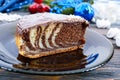 A piece of delicious two-color cake with chocolate and coconut chips Royalty Free Stock Photo