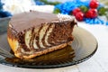 A piece of delicious two-color cake with chocolate and coconut chips Royalty Free Stock Photo