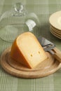 Piece of Dutch Gouda cheese on a wooden board Royalty Free Stock Photo
