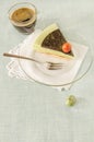 Piece of easter cake with tea matcha decorated chocolate ganache and sweet-stuff eggs on glass plate Royalty Free Stock Photo