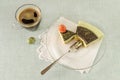 Piece of easter cake with tea matcha decorated chocolate ganache and sweet-stuff eggs on glass plate Royalty Free Stock Photo