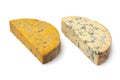 Piece of English Shropshire Blue cheese and a piece of Stilton cheese on white background Royalty Free Stock Photo