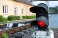 Piece of equipment shining a red light next to the train Royalty Free Stock Photo