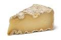 Piece of French Mountain Abbey cheese on white background close up