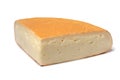Piece of fresh Chaumes cheese close up on white background Royalty Free Stock Photo