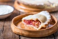 Piece of fresh rhubarb and strawberry pie with cream nearby Royalty Free Stock Photo