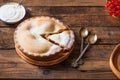 Piece of fresh rhubarb and strawberry pie with cream nearby Royalty Free Stock Photo