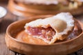 Piece of fresh rhubarb and strawberry pie with cream nearby Royalty Free Stock Photo