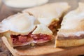 Piece of fresh rhubarb and strawberry pie with cream nearby Royalty Free Stock Photo