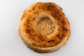 A piece of fresh round bread on white. Royalty Free Stock Photo