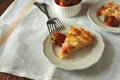 Piece of fresh strawberry and rhubarb pie on plate. Summer food eating Royalty Free Stock Photo