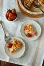 Piece of fresh strawberry and rhubarb pie on plate. Summer food eating. Top view Royalty Free Stock Photo