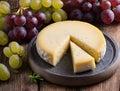 Food Cheese Grana Padano on cutting board with grapes
