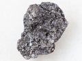 piece of Graphite stone on white marble Royalty Free Stock Photo