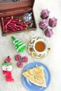 Piece of greek feta cheese pie, tea and Christmas ornaments Royalty Free Stock Photo