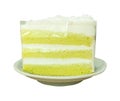 A piece of green and white coconut cake in mini white plate isolated on white background with clipping path Royalty Free Stock Photo
