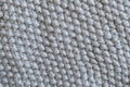 Piece of grey knitted fabric, Pearl Pattern Knitting. Background or texture Royalty Free Stock Photo