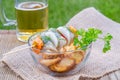 Piece of Herring on a Stick and Beer Royalty Free Stock Photo