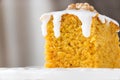 Piece of homemade carrot cake with nut and icing cream. Selective focus. Close up