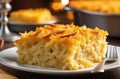 Piece of homemade Jewish Noodle Kugel Breakfast on wooden table and candles on the background