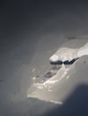 Piece of ice with contour and sun flares