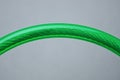 Piece of iron wire rope in transparent green plastic isolation Royalty Free Stock Photo