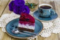 Piece of jelly mousse cake with fruit, cup of tea Royalty Free Stock Photo