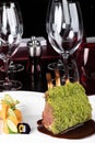 Piece of lamb rack with bone roasted with green herb, bread, sweet potatoes puree, baby vegetables Royalty Free Stock Photo
