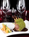 Piece of lamb rack with bone roasted with green herb, bread, sweet potatoes puree, baby vegetables Royalty Free Stock Photo