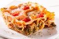 Piece of lasagna close-up on white plate Royalty Free Stock Photo