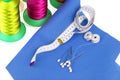 A piece of leatherette with needles and thread. Sewing workshop. Royalty Free Stock Photo