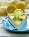 Piece of lemon cake tart decorated with fresh lemon