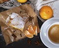 piece of mandarin pie with powdered sugar and white cup of coffee Royalty Free Stock Photo