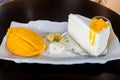 A piece of mango cheese cake on table wooden Royalty Free Stock Photo