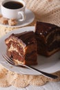 Piece of marble cake closeup on a plate and coffee on the table. Royalty Free Stock Photo