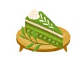 Piece of matcha cake with green tea flavor, served on wooden board with leaves. Japanese vegan dessert. Healthy Asian