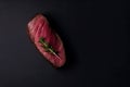 A piece of meat with a sprig of parsley. AI generative image . A lot of copy space.
