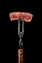 Piece of medium rare steak on the fork Royalty Free Stock Photo