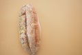A piece of mold bread on a light orange background Royalty Free Stock Photo