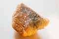 Piece of moldy bread on light background. Food not suitable for consumption Royalty Free Stock Photo