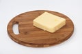 Piece of mozzarella cheese on a kitchen wooden board Royalty Free Stock Photo