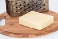 Piece of mozzarella cheese and metal grater on a kitchen wooden Royalty Free Stock Photo