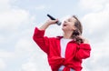 Piece of music. make your voice louder. teen girl singing song with microphone. having a party. Happy kid with Royalty Free Stock Photo
