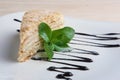 Piece of napoleon cake on plate with chocolate sauce. Puff pastry cake with custard Royalty Free Stock Photo