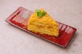 piece of Napoleon Cake on red plate Royalty Free Stock Photo