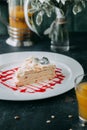 A piece of Napoleon cake on a white plate