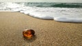 A piece of natural Baltic amber , taken close up on the beach.