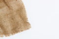 A piece of old burlap, isolated on a white background Royalty Free Stock Photo