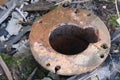 piece of old rusty iron pipe sticking out of the ground Royalty Free Stock Photo