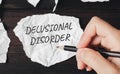 A piece of paper with the inscription delusional disorder. Delusional disorder is a mental illness